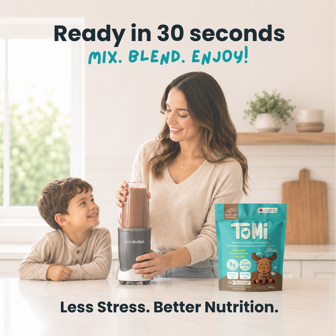 Woman and child in a kitchen with a blender and TOMi powder, promoting quick and easy nutrition.