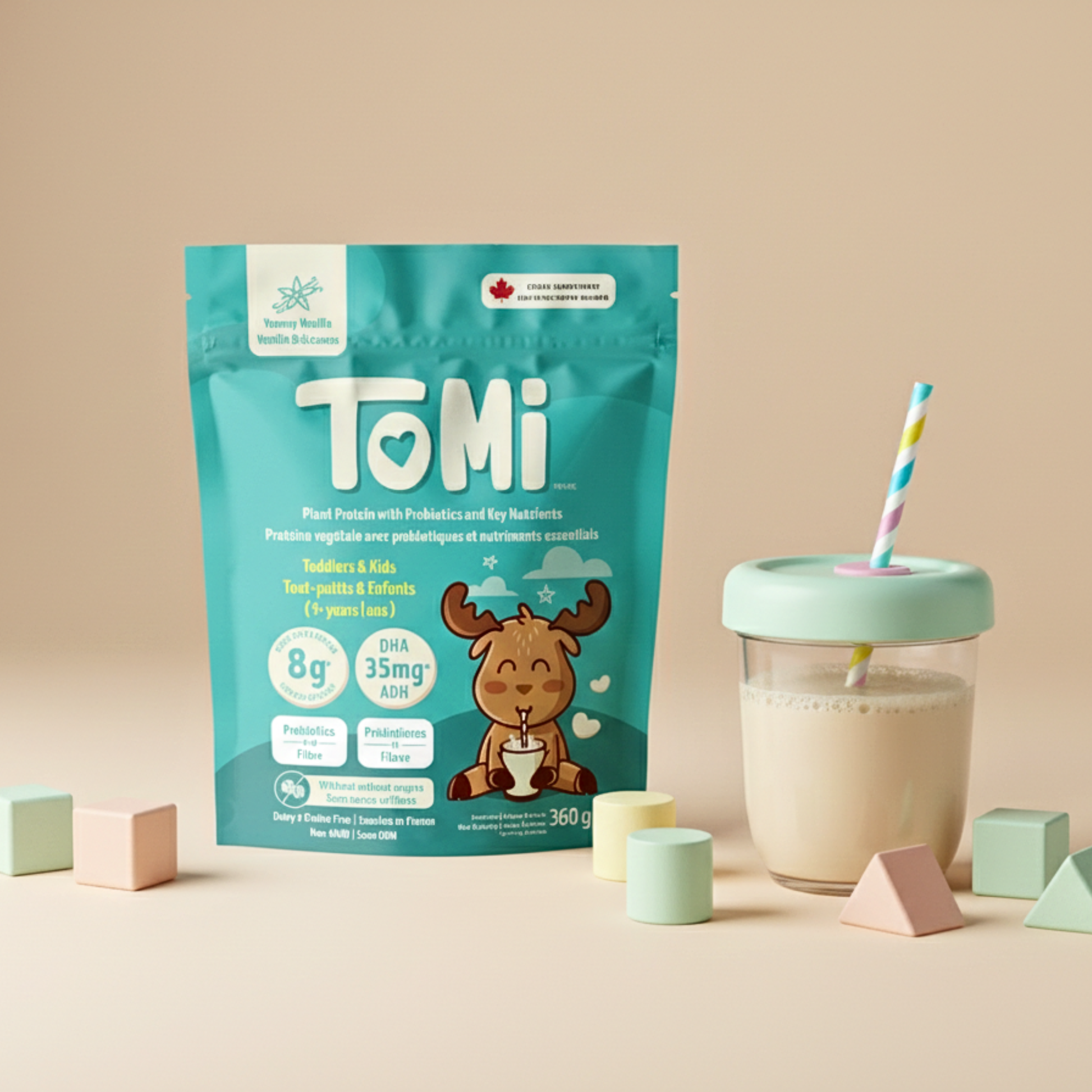 Plant-based protein powder for kids (TOMI vanilla) next to prepared drink in cup with straw, showing creamy texture and kid-friendly packaging